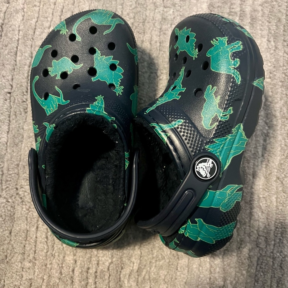 Croc’s child size 9. Navy blue with dinosaurs.